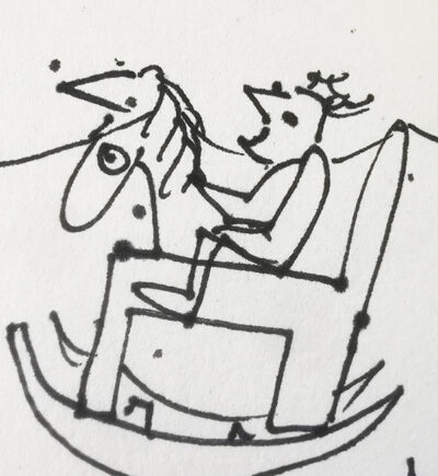 A small child on a rocking horse.